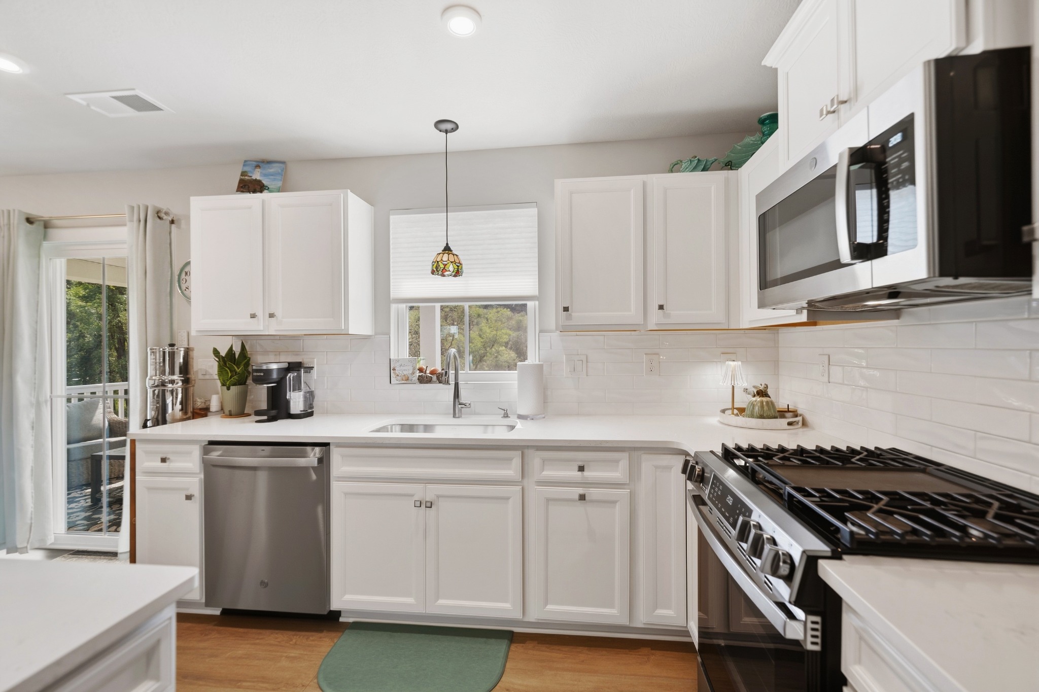 Large gas range in white kitchen